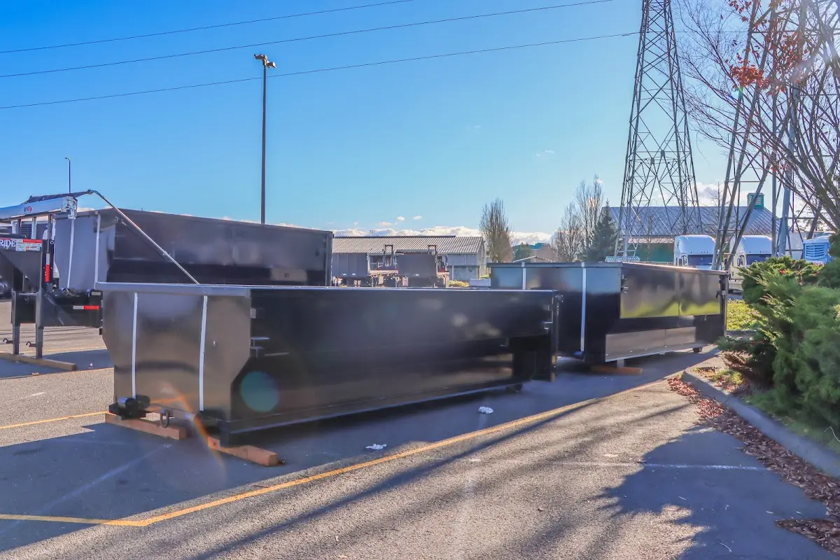 Roll-off dumpster ready for waste disposal at job site for 12 Yard Dumpster Rental in Spring